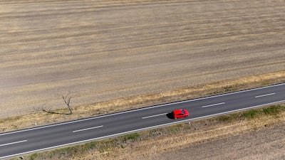 A car drives pas dried-out fields in Leopoldsdorf im Marchfelde, Austria. Much of Europe is bracing for yet another scorching heatwave following periods of record drought that have driven rivers to historic lows, ignited historic forest fires and contributed to thousands of deaths. Unusually high temperatures were also forecast in the coming days across a number of countries not accustomed to the heat, such as Switzerland, Austria and Hungary. AFP