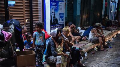A Honduran migrant family taking part in a caravan heading to the US, rest on their arrival to Huixtla, Chiapas state, Mexico, on October 22, 2018. AFP
