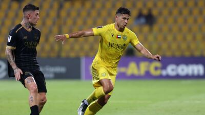 Al Wasl's Alexis Perez evades the attentions of Al Sadd's Cristo Gonzalez.