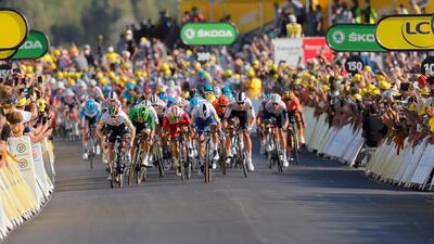 Ireland's Sam Bennett, far left in white, on his way to victory in a sprint finish. AP