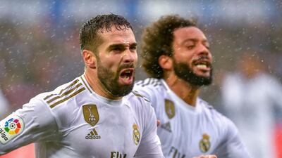 Real Madrid's Spanish defender Daniel Carvajal (L) celebrates after scoring his side's second goal in a 2-1 win over Alaves. AFP