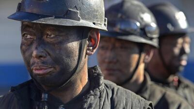 Miners wait in lines to shower during a break near a coal mine in Heshun county, Shanxi province on December 5, 2014. Chinese coal spot prices are being raised in a domestic market struggling to recover from seven-year lows, desperate for an edge in annual negotiations to supply power plants, key buyers in the world's biggest consumer of coal, industry sources say. Reuters