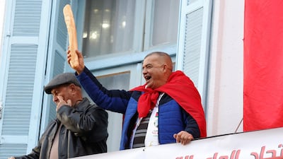 A man holds a loaf of bread during the nationwide strike. Reuters