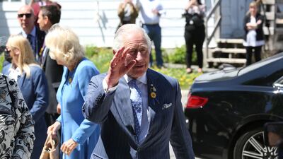 Britain's Prince Charles and Camilla, Duchess of Cornwall waves during a visit at Assumption Catholic school May 18, 2022 in Ottawa. AFP