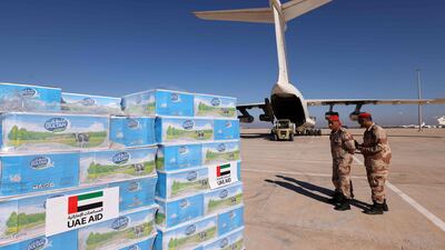 Military personnel supervise the arrival of UAE aid at Benina Airport in Benghazi for survivors of deadly floods in eastern Libya. AFP