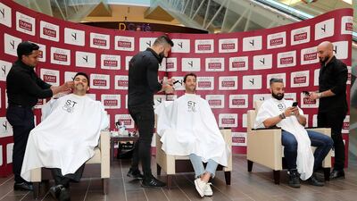 Dr. Shamsheer Vayalil, chairman and managing director of VPS Healthcare; Ricciardo; and Fade doing a Movember shave.