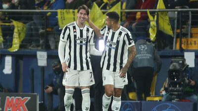 Juventus' Dusan Vlahovic, left, celebrates with teammate Danillo after scoring in Spain. AP
