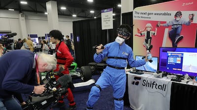 Shiftall's HaritoraX wireless full-body tracking device allows users to play VR games in the metaverse. Getty