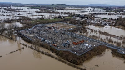 Floodwater surrounds an electricity grid substation in Gloucester. PA
