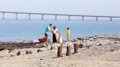 US citizens in Kuwait take part in a cleanup campaign at Asheraj beach. AFP