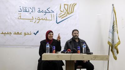 Canadian citizens Jolly Bimbachi (L) and Sean Moore, who were being held by Hayat Tahrir Al Sham in northwest Syria, give a press conference at the Bab Al Hawa crossing with Turkey on February 5, 2018 after they were released to Turkish authorities. Omar Haj Kadour / AFP