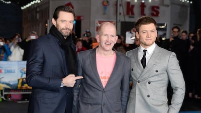 From left, Hugh Jackman, Eddie Edwards and Taron Egerton at the European premiere of Eddie The Eagle at Odeon Leicester Square in London. Jeff Spicer / Getty Images