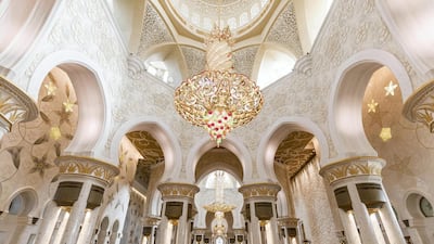 The mosque will be nearly identical, only smaller, with four minarets and several domes. Victor Besa / The National