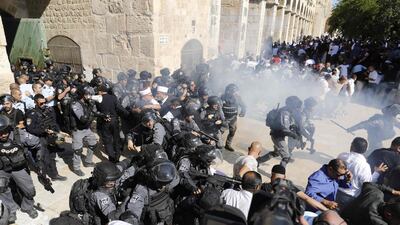 Israeli security forces fire sound grenades during clashes with Palestinians inside the Al Aqsa Mosque compound in Jerusalem on August 11, 2019. AFP