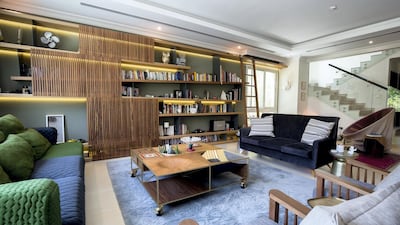 A large wall unit made of walnut defines the living room. Ruel Pableo for The National