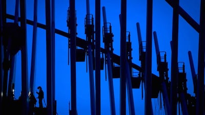 A welder works on part of the World Trade Center after sunset in New York October 24, 2014. Carlo Allegri / Reuters
