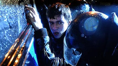 A riot policeman detains an opposition supporter during a rally in central Moscow on Monday.