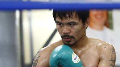 Manny Pacquiao won his most recent fight against Chris Algieri in Macau. Mike Young / The National