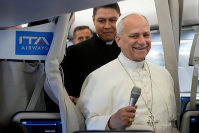 Pope Leo XIV talks to journalists aboard the papal flight from Rome to Paris. Reuters