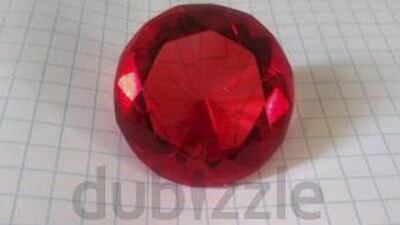 Aladdin Production Ruby. Description: "Piece is huge - measures 2x2x2 inches. From the Sotheby's auction in 199. Ready to hang on the wall! Or enjoy it as a huge piece of jewelry". Verified by dubizzle? No. Courtesy Dubizzle