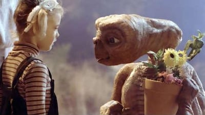 ET, starring Drew Barrymore, left, held the record as the highest-grossing film for 11 years.