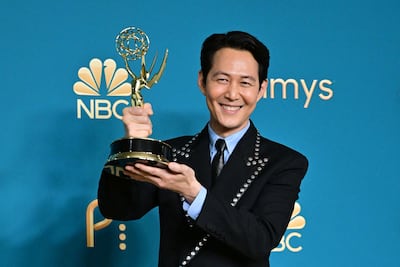 South Korean actor Lee Jung-jae with the award for Outstanding Lead Actor in a Drama Series for 'Squid Game'. AFP