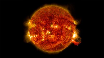 A surge of solar material explodes off the sun's lower right side. Photo: Nasa