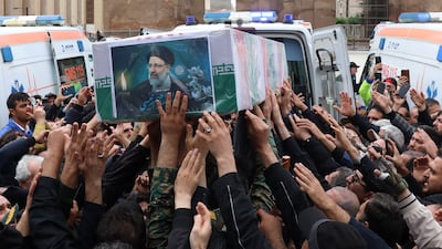 Mourners gather round the coffin carrying Ebrahim Raisi during a funeral procession in Tabriz, the capital of Iran's East Azerbaijan province, on May 21. AFP