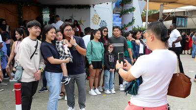 The congregation mingled outside after the service to take selfies and chat with family and friends