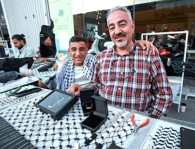 Malek Salhab,18, and Ibrahim Bader at The Coral Beach stall. Victor Besa / The National