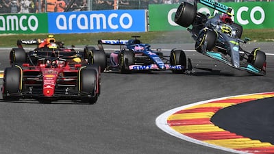Mercedes' British driver Lewis Hamilton collides with Alpine's Spanish driver Fernando Alonso. AFP