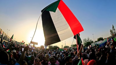 Sudanese demonstrators gather outside the army complex in the capital Khartoum. Ashraf Shazly / AFP