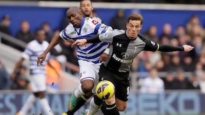 Queens Park Rangers' Stephane Mbia challenges Tottenham Hotspur's Scott Parker. Alastair Grant / AP Photo