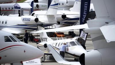 A visitor look inside one of the planes on exhibit at the European Business Aviation Convention and Exhibition in Geneva. Fabrice Coffrini / AFP