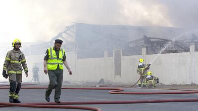 The fire on Sunday destroyed Al Sana Fashions’ main warehouse and head office in Al Quoz. The body of one of the two men missing was found yesterday by fire crews. Christopher Pike / The National