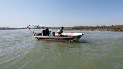 Iraqi rescuers search for victims on the Tigris river. Reuters