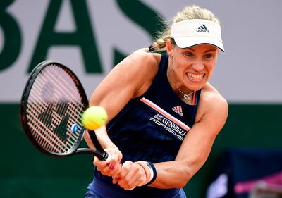 Angelique Kerber will face Simona Halep in the quarter-finals after ending French hopes by defeating Caroline Garcia. Carline Blumberg / EPA