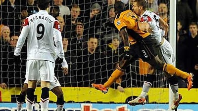 George Elokobi, second right, equalises for Wolves yesterday at Molineux.
