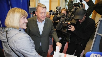 Leader of the Moderate Party Lars Loekke Rasmussen and his wife Solrun vote at Nyboder School in Copenhagen. Reuters