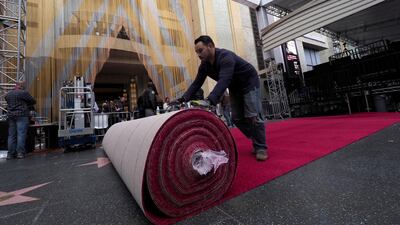 A worker rolls out the red carpet for the 91st Academy Awards take place in Hollywood.. EPA