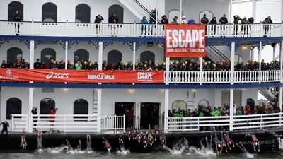 Triathletes dive off a boat at the beginning of the 34th Escape from Alcatraz Triathlon on Sunday in San Francisco, California. Ezra Shaw / Getty Images / AFP / June 1, 2014