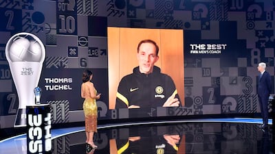 The Best FIFA Men's Coach 2021 award winner Thomas Tuchel speaks with FIFA Chief of Global Football Development Arsene Wenger, right, and presenter Reshmin Chowdhury. AP