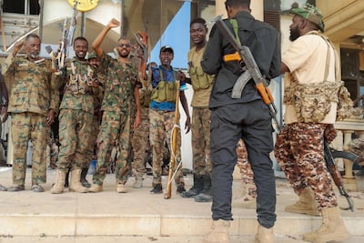 Sudanese army troops inside the presidential palace in Khartoum on Friday. AFP