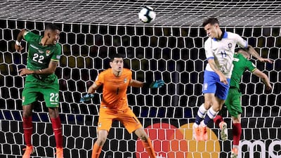 Brazil's Philippe Coutinho in action with Bolivia's Adrian Jusino and Carlos Lampe. Reuters