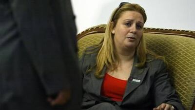 Yasser Arafat's wife, Suha, waits to leave the Alenby Bridge crossing point between Israel and Jordan on her way to visit her sick husband in Ramallah in 2004.