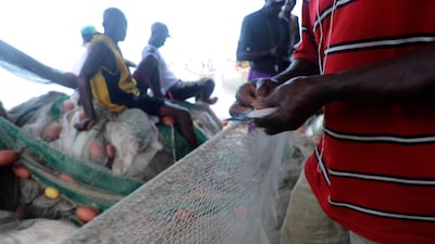 Fishing nets are expensive and time-consuming to make. The entire community lends a hand to ensure the fisherman have the best chance of bringing home a valuable catch. Andy Scott / The National