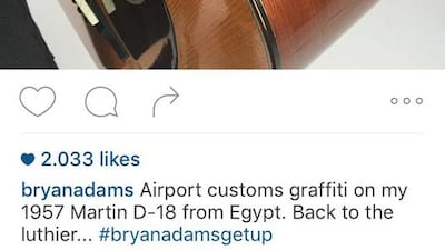 This picture posted to Bryan Adams' Instagram account shows his vintage Martin acoustic guitar after it was scrawled on in green marker by a border agent at Cairo airport. AFP Photo/Handout/Bryan Adams' Instagram