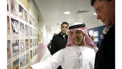 Dr Mugheer Al Khaili, the director general of Adec, and the French minister of state for foreign affairs Edouard Courtial tour the new building at the Lycee Louis Massignon school. Sammy Dallal / The National