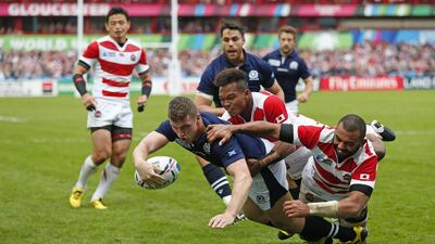 Mark Bennett of Scotland scores their fourth try against Japan on Wednesday in their Rugby World Cup victory. Eddie Keogh / Reuters