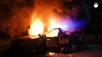 A police car burns during a protest on May 29, 2020 in Atlanta, Georgia. Getty Images/AFP